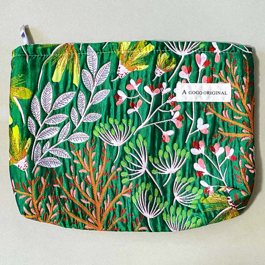 emerald conservatory tapestry pouch featuring a woven satin botanical design in emerald green, coral pink and cream with concealed zip fastening and cream lined interior. Uk luxury letterbox gifts shop. 