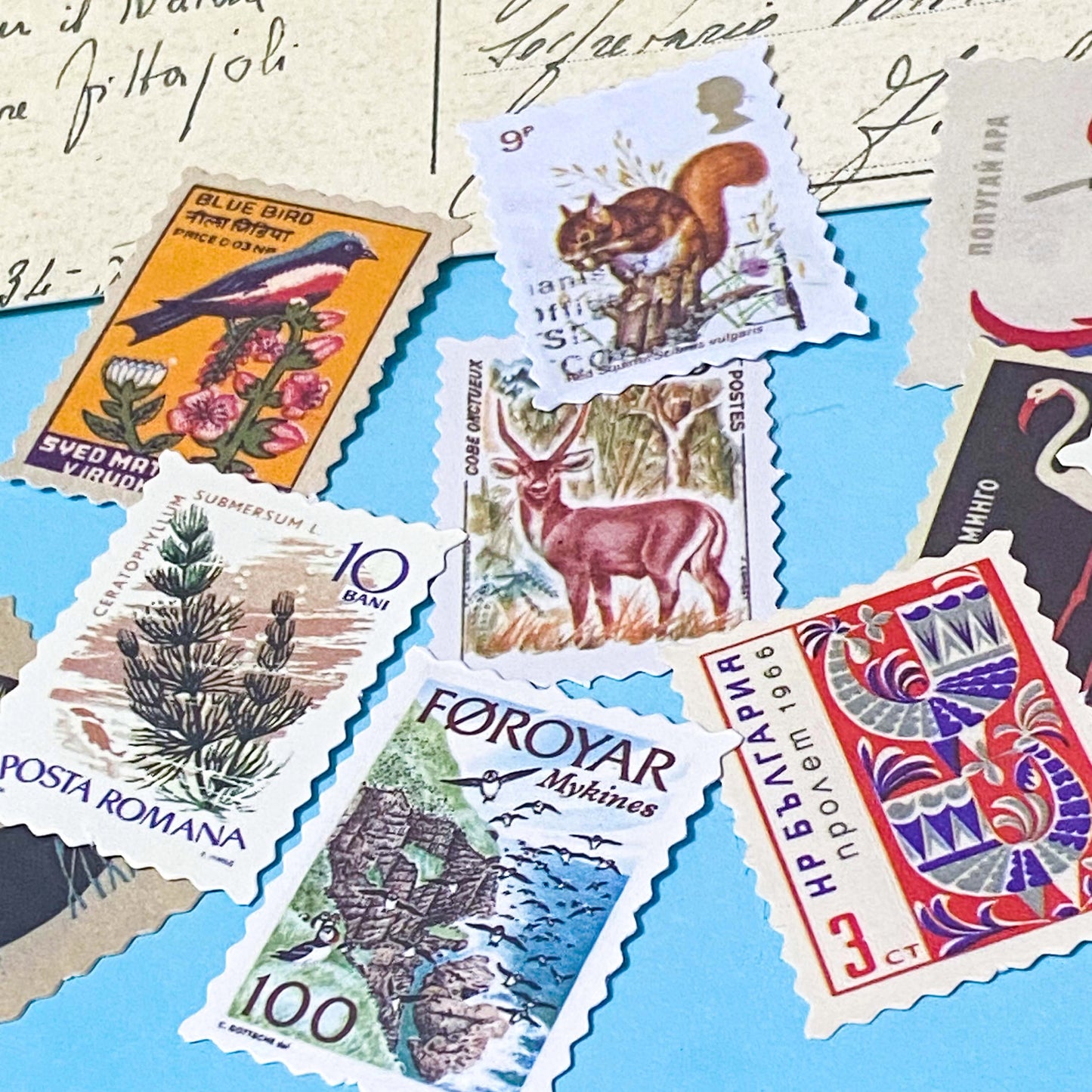 set of vintage style postage stamp stickers featuring birds, animals and plants on matte paper for journalling and scrapbooking