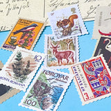 set of vintage style postage stamp stickers featuring birds, animals and plants on matte paper for journalling and scrapbooking