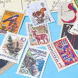 set of vintage style postage stamp stickers featuring birds, animals and plants on matte paper for journalling and scrapbooking