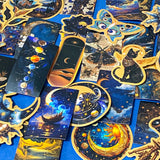 set of 50 dark celestial aesthetic stickers featuring stars, moons, planets, botanical illustrations and mystical designs in deep blue and gold tones