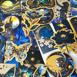 set of 50 dark celestial aesthetic stickers featuring stars, moons, planets, botanical illustrations and mystical designs in deep blue and gold tones