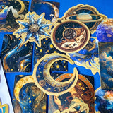 set of 50 dark celestial aesthetic stickers featuring stars, moons, planets, botanical illustrations and mystical designs in deep blue and gold tones