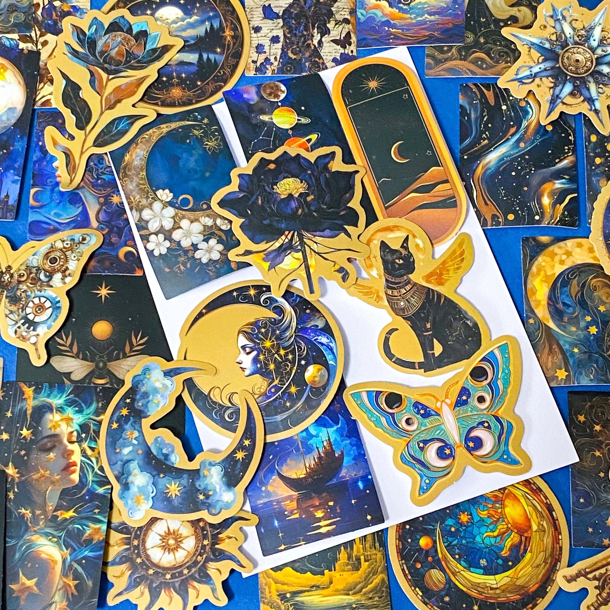 set of 50 dark celestial aesthetic stickers featuring stars, moons, planets, botanical illustrations and mystical designs in deep blue and gold tones