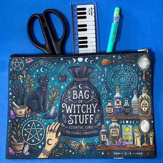 black cat apothecary zip pouch featuring witchy illustrations including a black cat potion bottles, crystals, herbs and moon phases. Teal and black fabric cosmetic bag. 