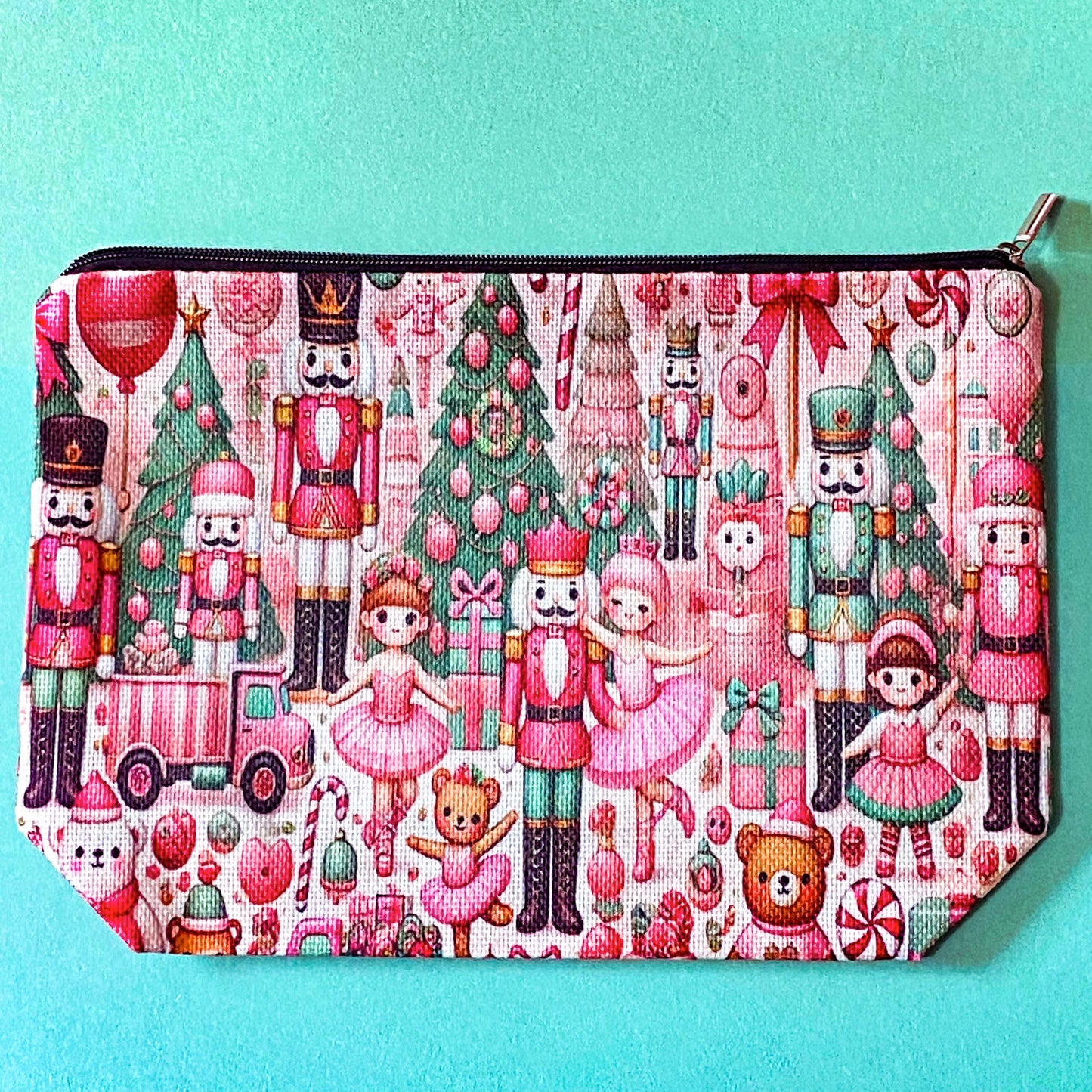 pink woven christmas zip canvas pouch featuring nutcrackers, ballerinas, trees, bears, festive gifts and toys. uk letterbox gifts. cosmetic bag.