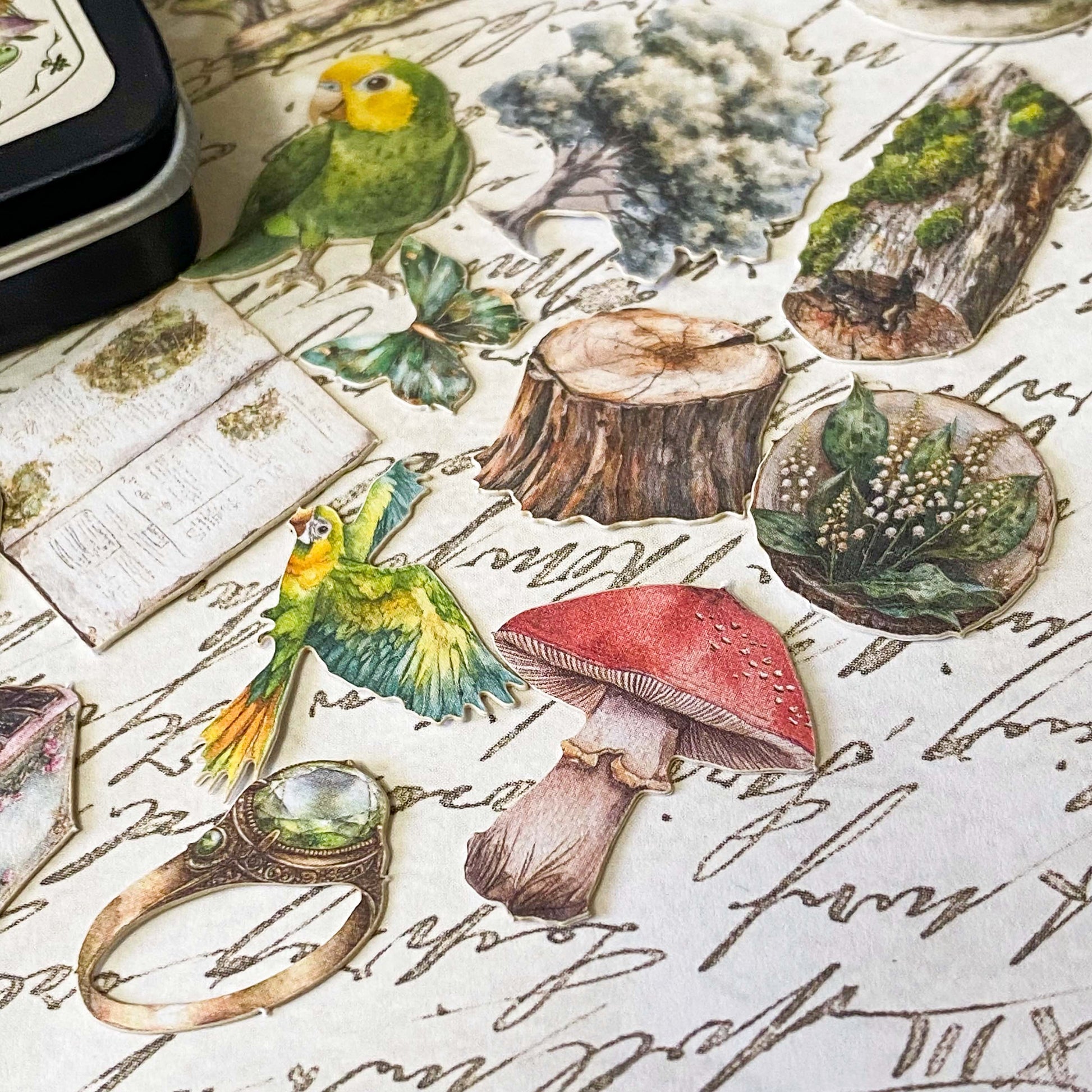 mini tin of 60 card stickers in an enchanted forest theme with mushrooms, berries, birds, books, butterflies, tree stumps and diamond rings