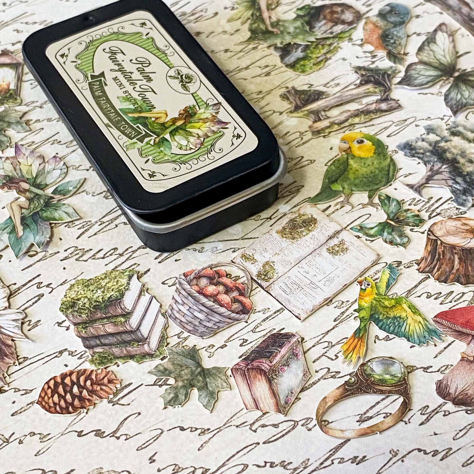 mini tin of 60 card stickers in an enchanted forest theme with mushrooms, berries, birds, books, butterflies, tree stumps and diamond rings