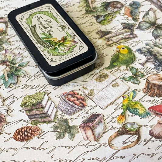 mini tin of 60 card stickers in an enchanted forest theme with mushrooms, berries, birds, books, butterflies, tree stumps and diamond rings