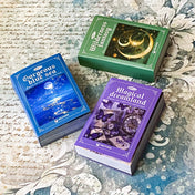 three mini scrapbook paper and vellum books in purple. lue and green themes with 100 sheets each for collage and journaling