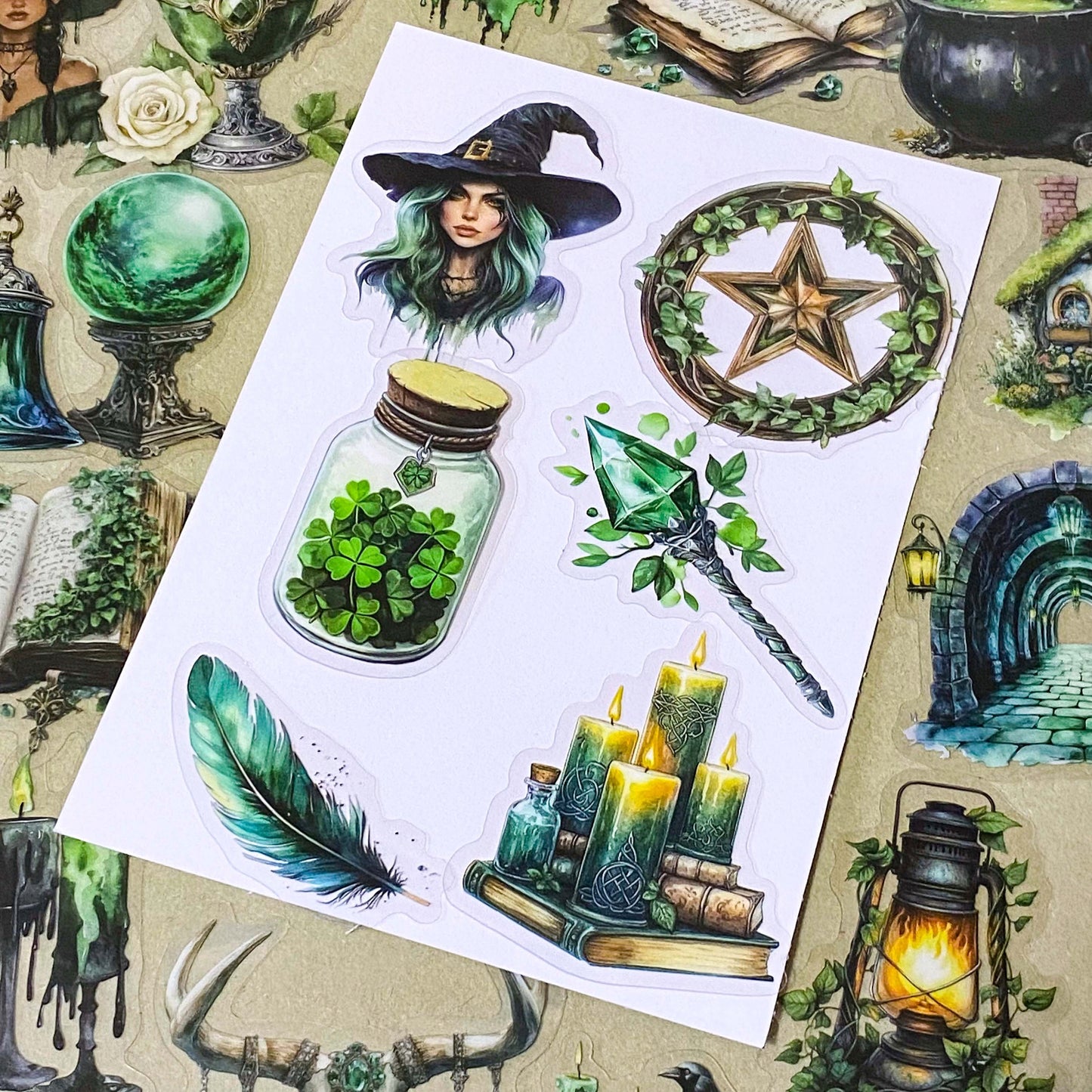 pack of 50 different emerald green magical stickers featuring witches, spell books, crystals, ravens, lanterns, enchanted moths, potion bottles and fantasy green clear PET illustrations. Uk stationery shop.