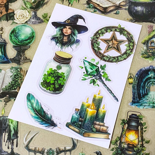 pack of 50 different emerald green magical stickers featuring witches, spell books, crystals, ravens, lanterns, enchanted moths, potion bottles and fantasy green clear PET illustrations. Uk stationery shop.