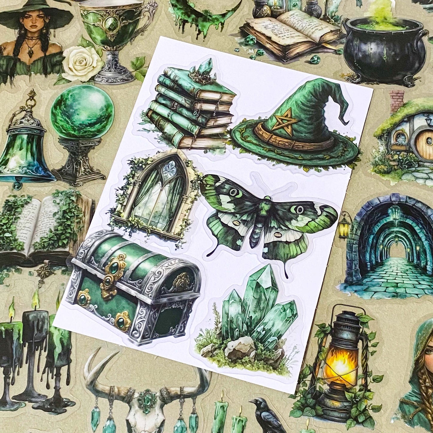 pack of 50 different emerald green magical stickers featuring witches, spell books, crystals, ravens, lanterns, enchanted moths, potion bottles and fantasy green clear PET illustrations. Uk stationery shop.