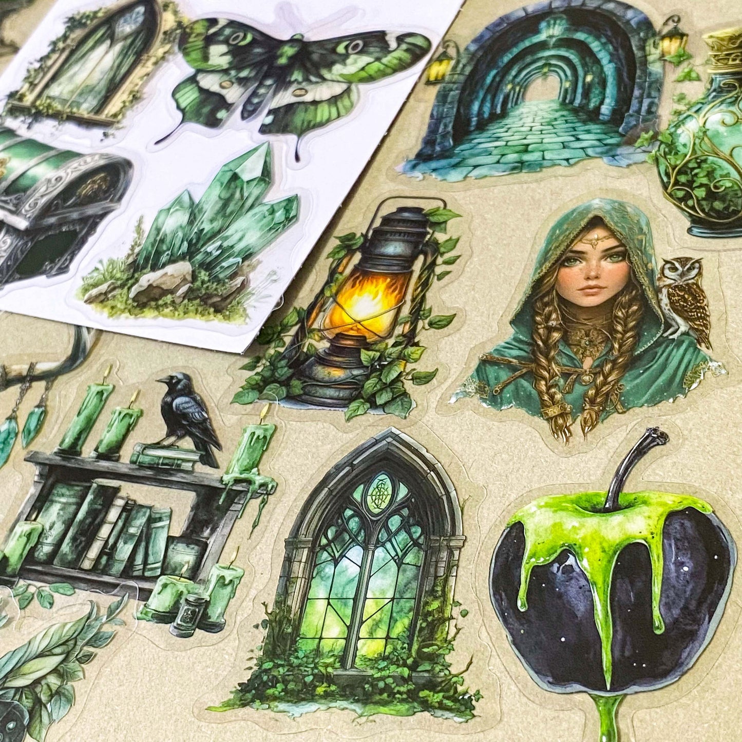 pack of 50 different emerald green magical stickers featuring witches, spell books, crystals, ravens, lanterns, enchanted moths, potion bottles and fantasy green clear PET illustrations. Uk stationery shop.