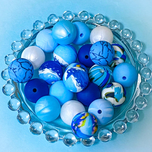 ocean waves blue and white 16mm round silicone beads. individual crackle pattern, swirly marbled, light blue, dark blue, water and abstract. uk craft supplies shop.