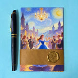 set of 6 romantic fantasy postcards featuring castle scenes, couples, golden fields and fairytale illustrations. angles with pen for scale and wrapped with a kraft belly band and wax seal sticker