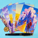 set of 6 romantic fantasy postcards featuring castle scenes, couples, golden fields and fairytale illustrations. angles with pen for scale. 