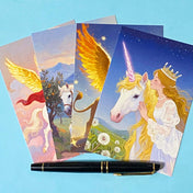 set of 4 fantasy postcards featuring mythical creatures including winged lion and unicorn with celestial skies, wrapped in kraft belly band with wax seal