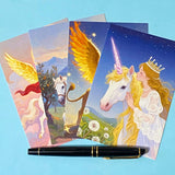 set of 4 fantasy postcards featuring mythical creatures including winged lion and unicorn with celestial skies, wrapped in kraft belly band with wax seal