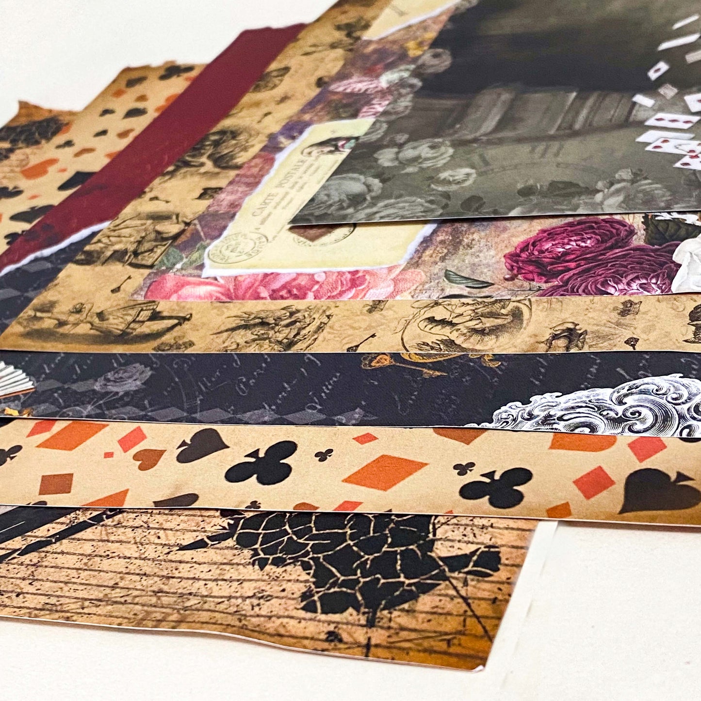 set of 6 alice in wonderland scrapbook paper sheets, double sided vintage collage deigns with clocks, playing cards and floral elements
