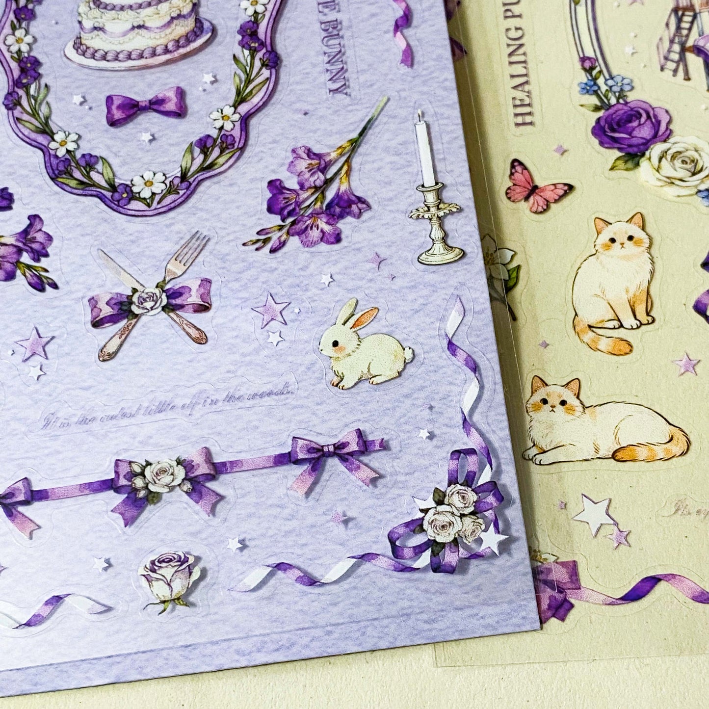 set of 2 purple floral clear sticker sheets with bunnies kittens bows and vintage style decorative elements
