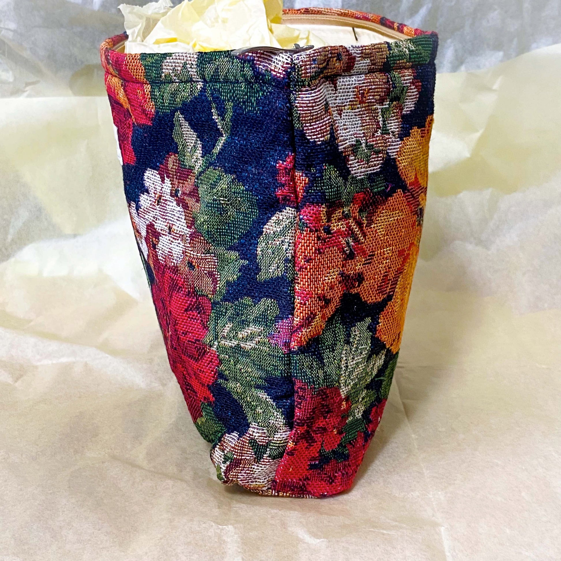 dark floral tapestry woven pouch with concealed zip fastening, lining and gusset. Large cosmetic bag with botanical design and textured fabric. manor garden. 