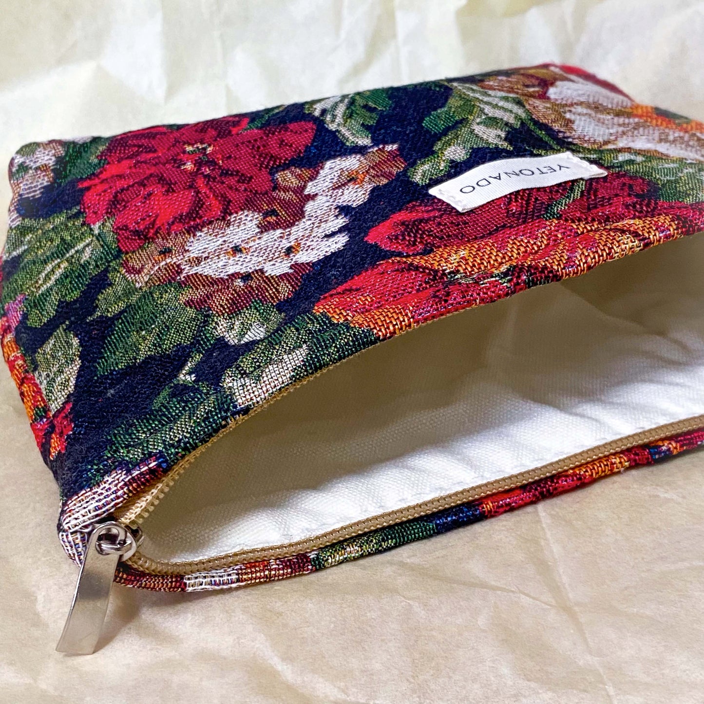 dark floral tapestry woven pouch with concealed zip fastening, lining and gusset. Large cosmetic bag with botanical design and textured fabric. manor garden. 