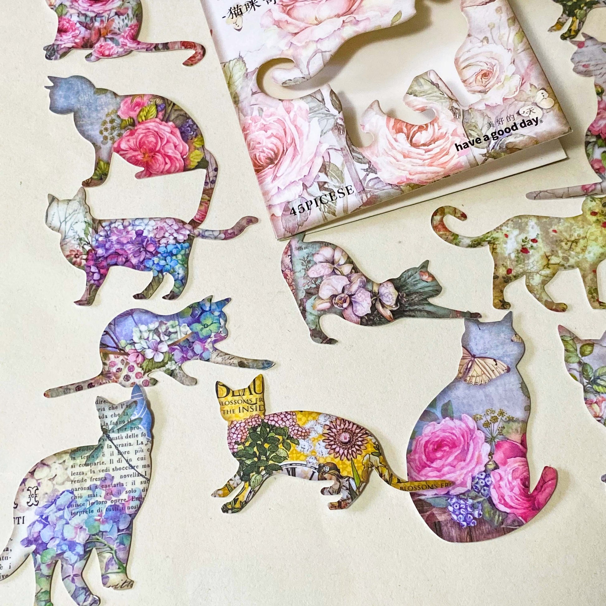 pack of 45 paper stickers featuring elegant cat silhouettes filled with vintage roes, hydrangeas, botanical flowers and antique inspired illustrations. uk stationery shop for journaling and scrapbooking.