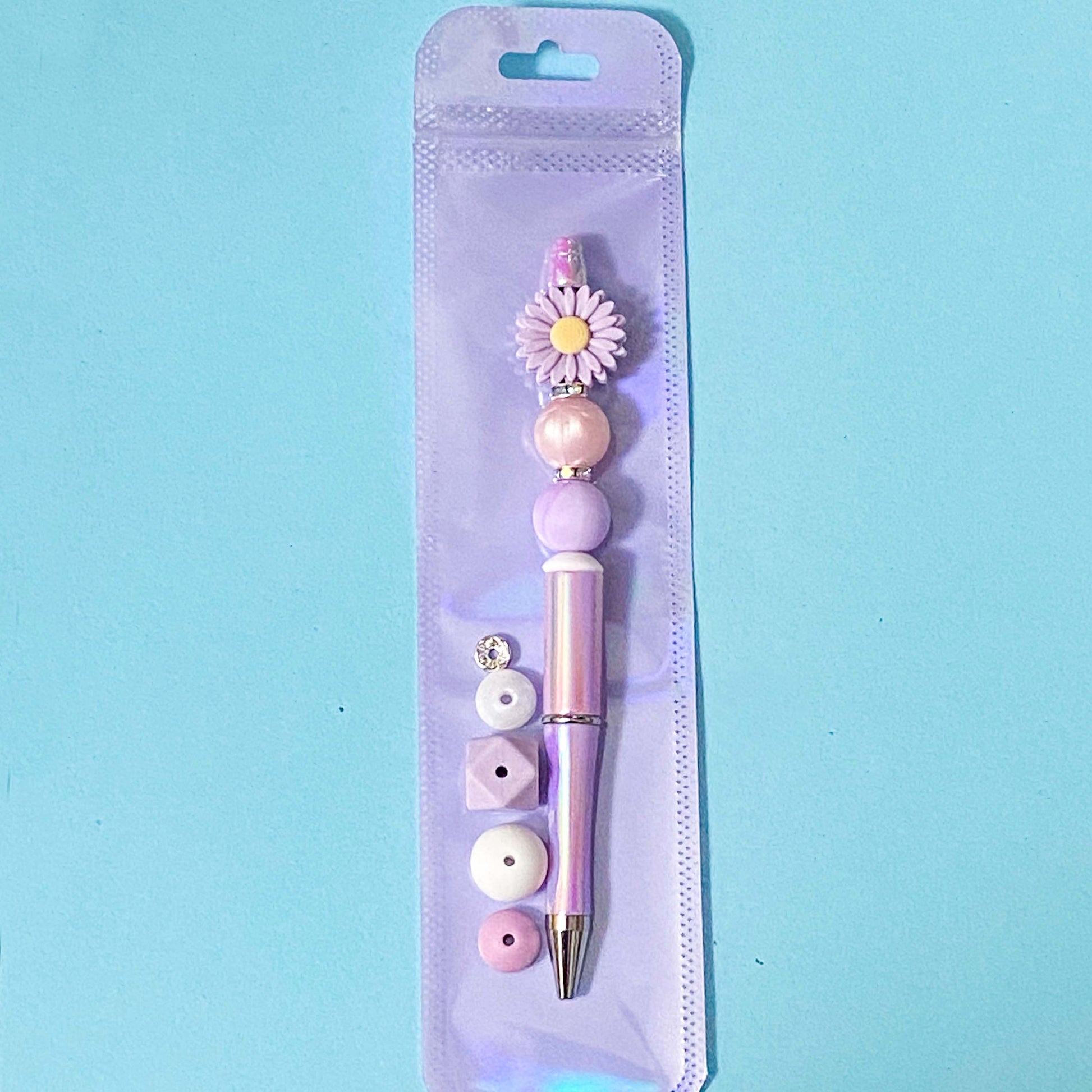 purple daisy silicone beaded pen kit diy in holographic bag with extra beads and pen refill