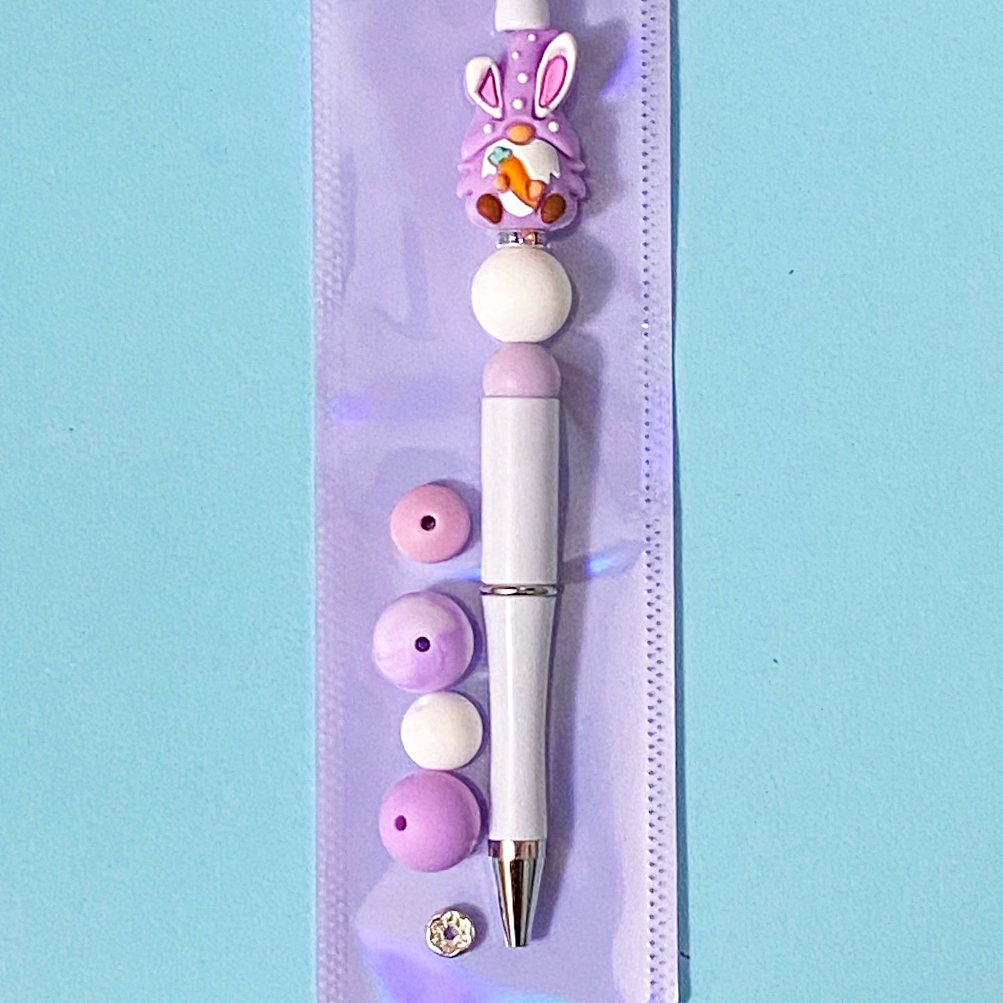 lilac bunny gnome cute silicone bead diy beaded pen kit on a blue background