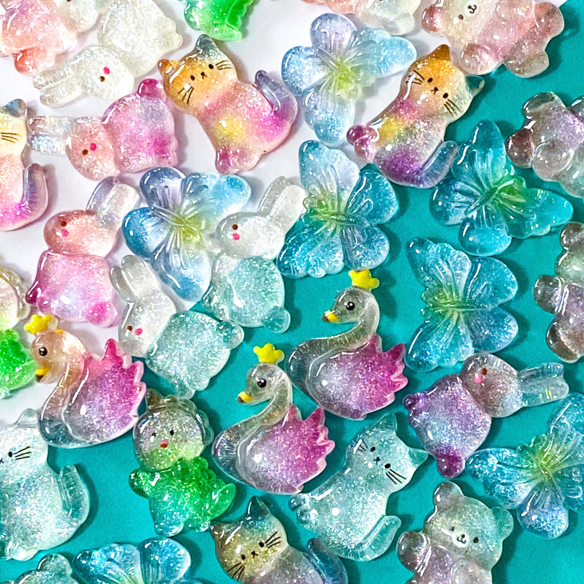 Cute kawaii glitter resin resins fb fbs flatbacks flat back Uk craft supplies shop store bunny rabbit rabbits rainbow glittery chunky cat cats kitty bow bows blue butterfly butterflies Swan Dino dinosaur dinosaurs 