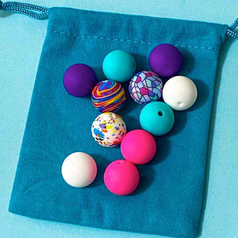 bundle of 11 round 16mm silicone beads in cosmic pop a vibrant mix of patterns and turquoise, purple, hot pink and white