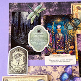 witchy potion oracle journalling kit with purple scrapbook papers, gothic prints, stickers, butterfly and beetle die cuts and mini glass vial jar
