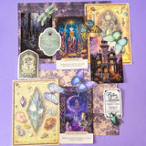 witchy potion oracle journalling kit with purple scrapbook papers, gothic prints, stickers, butterfly and beetle die cuts and mini glass vial jar