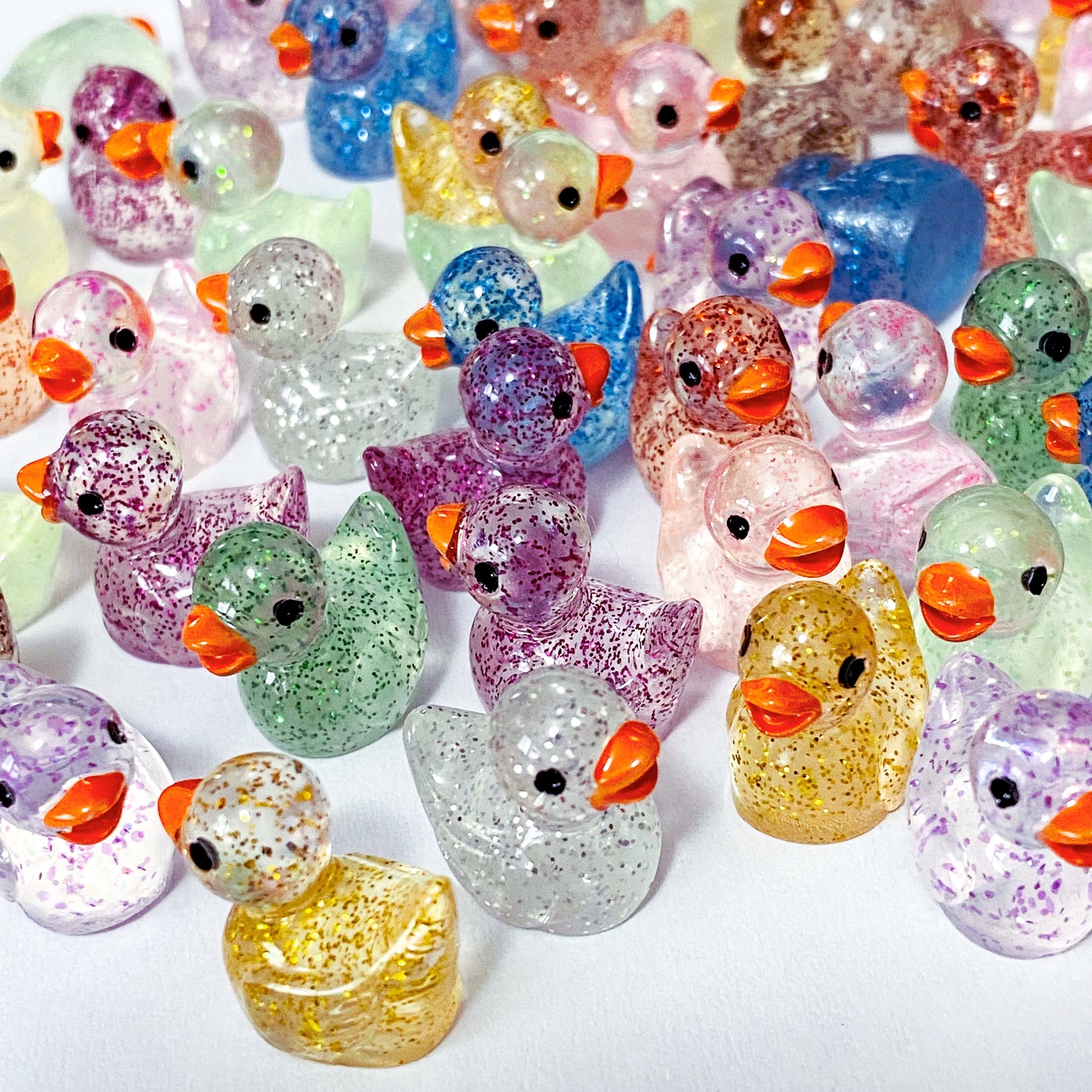 sparkly resin glitter glitters 3d duck ducks duckling ducklings flatback fb fbs flat back backs uk cute kawaii craft supplies shop miniature colourful clear pink lilac blue green yellow gold purple brown