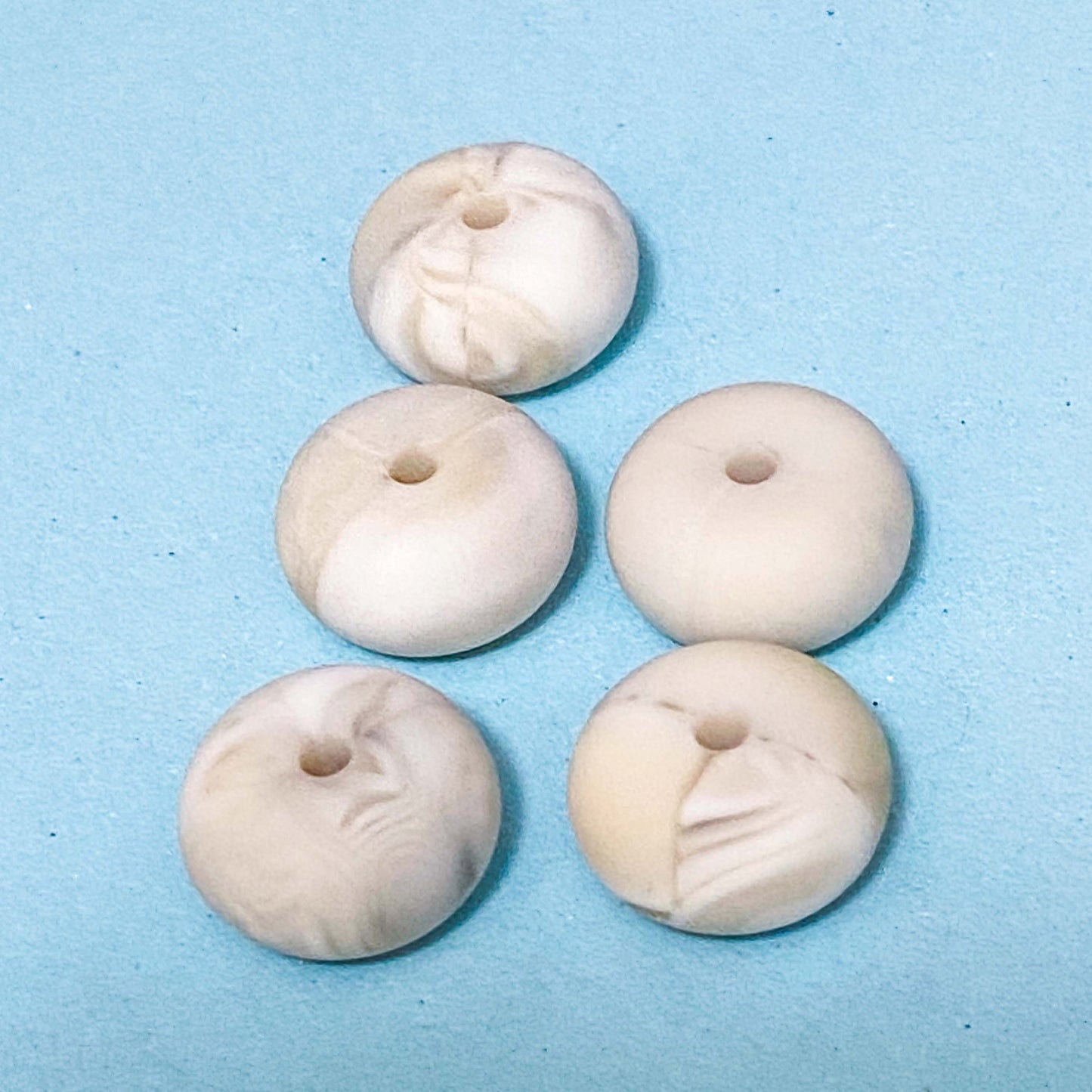 silicone spacer beads with a chunky shape and white marble pattern