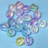 Multi-coloured striped or ridged 16mm acrylic blear round beads on a blue background