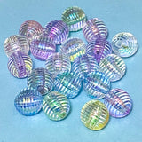 Multi-coloured striped 16mm acrylic blear round beads on a blue background
