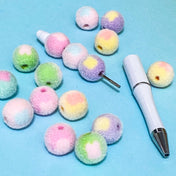 flocked fuzzy soft 16mm beads in spring pastel colours on a pen blank on a blue background