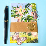 vintage botanical Kew Gardens postcard bundle wrapped in kraft belly band with wax seal sticker with insect die cuts and floral stickers ephemera