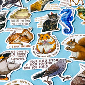 set of 50 animal positive quote stickers with affirmations featuring illustrated wildlife including hamsters, squirrels, deer, birds and seahorses on a soft blue background