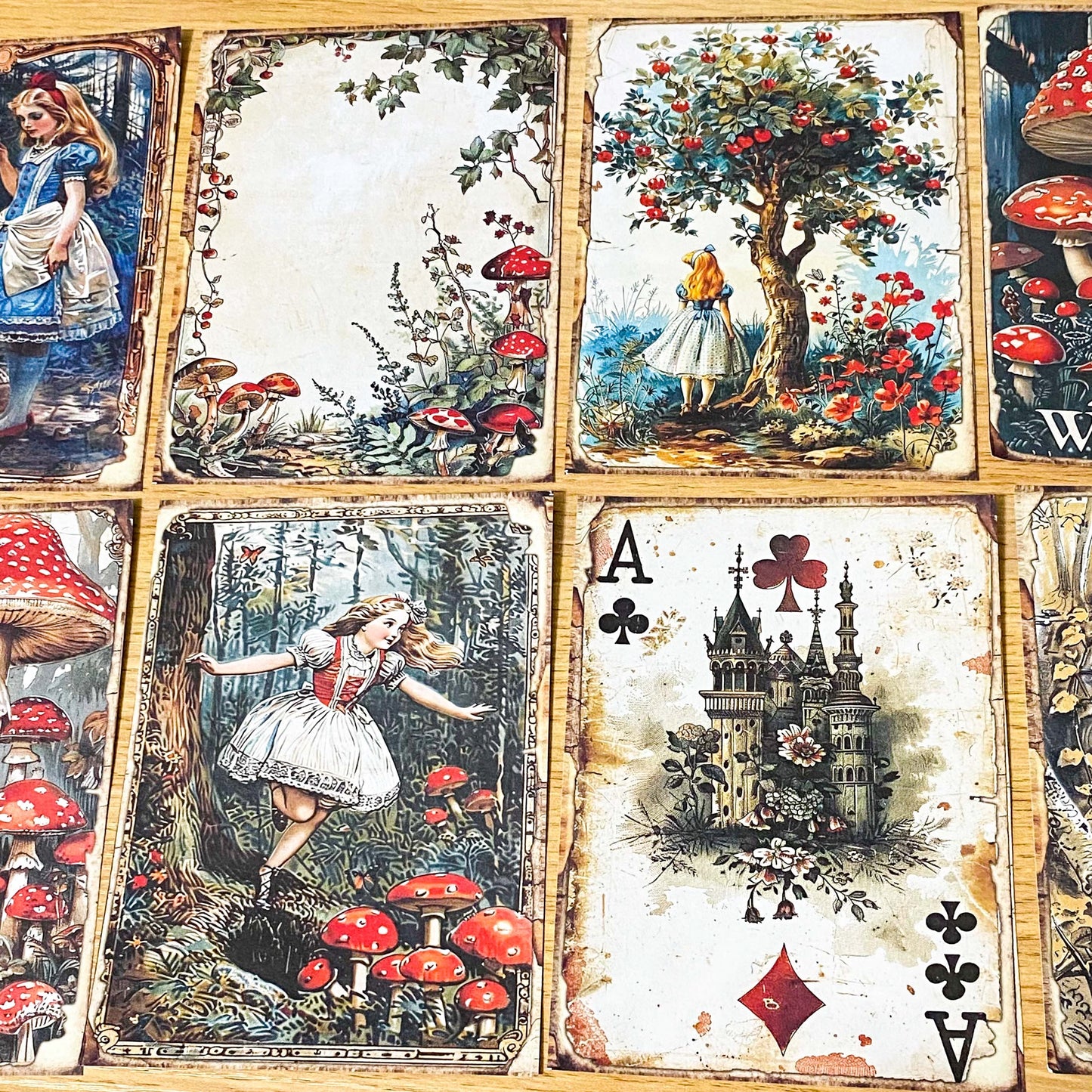alice in wonderland junk journal kit with vintage botanical scrapbook paper, mushroom labels, insect die cuts and a 20 page clear sticker book