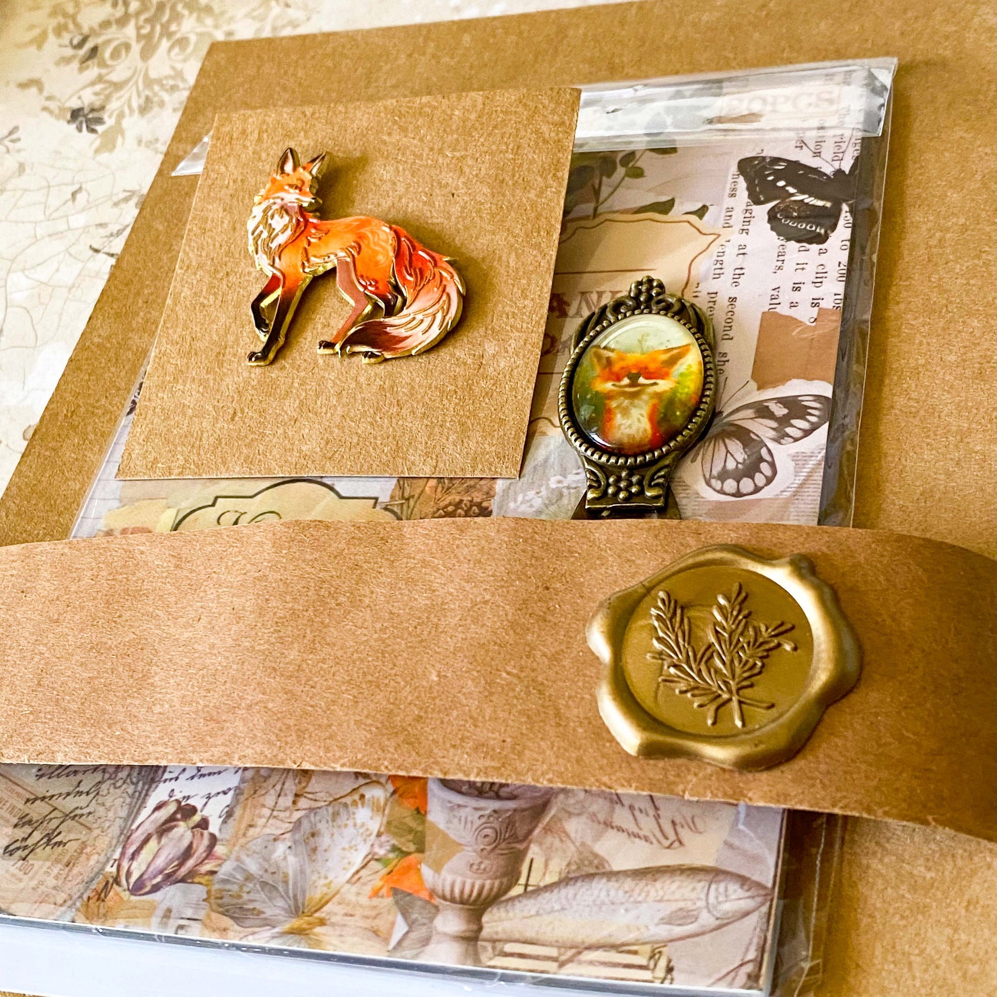 fox woodland letterbox gift set with vintage clear sticker book, botanical stickers, enamel fox pin and antique style fox metal bookmark