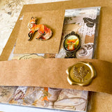 fox woodland letterbox gift set with vintage clear sticker book, botanical stickers, enamel fox pin and antique style fox metal bookmark