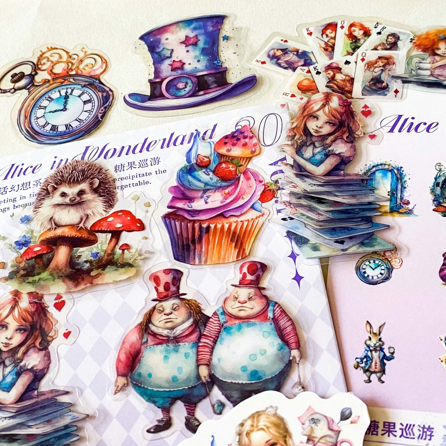 alice in wonderland dream garden clear PET stickers set with 30 large pastel stickers including Alice, White rabbit, Cheshire Cat, Tweedle Dum and Tweedle Dee, pocket watch and cupcake