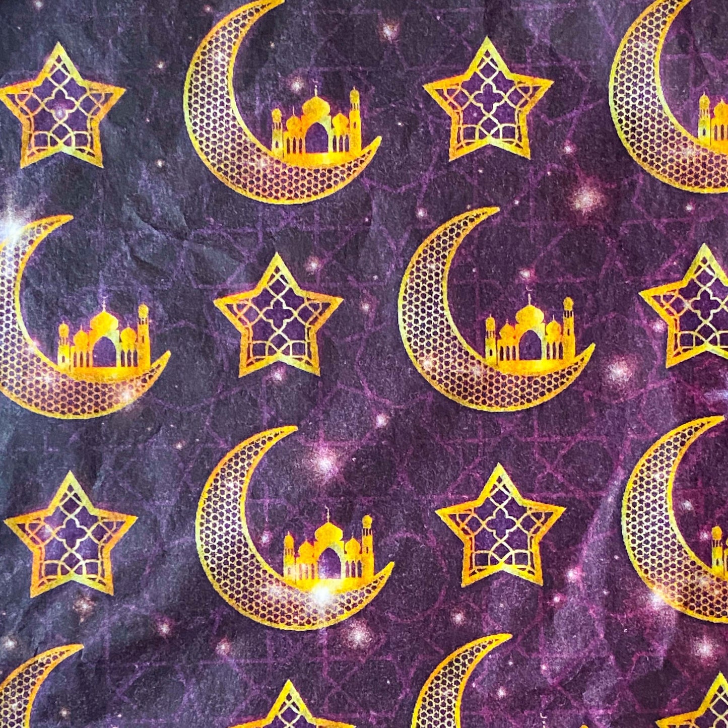 tissue paper with a Pattern of gold crescent moons, stars, and domed palace buildings on a purple background