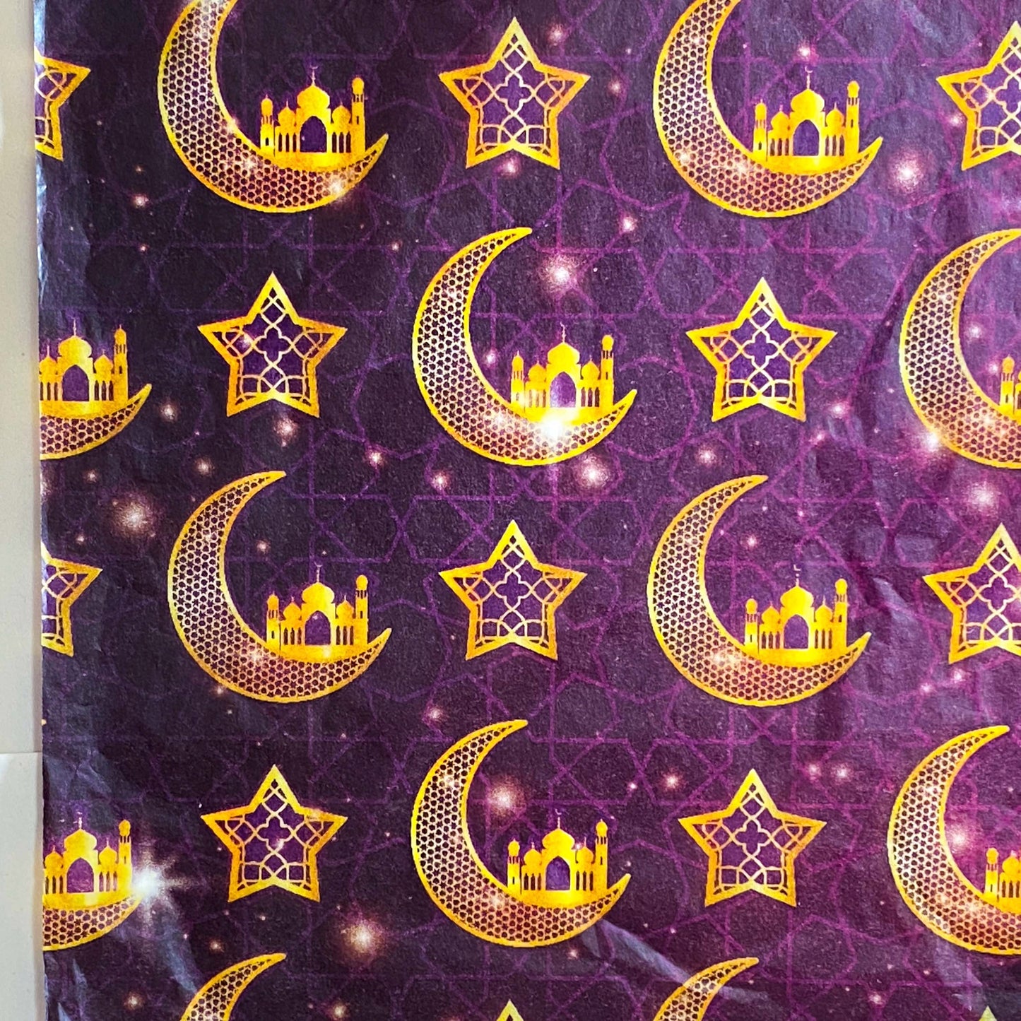 tissue paper with Pattern of gold crescent moons, stars, and palace domes on a deep plum purple background