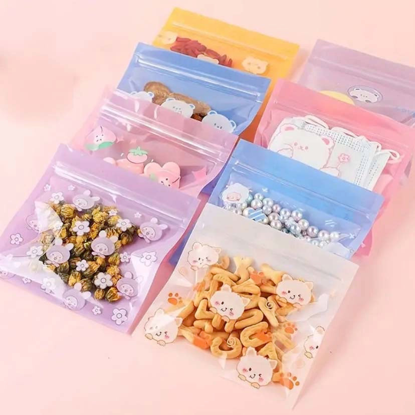 re-sealable ziplock spring bags with cute animal designs on a pink background