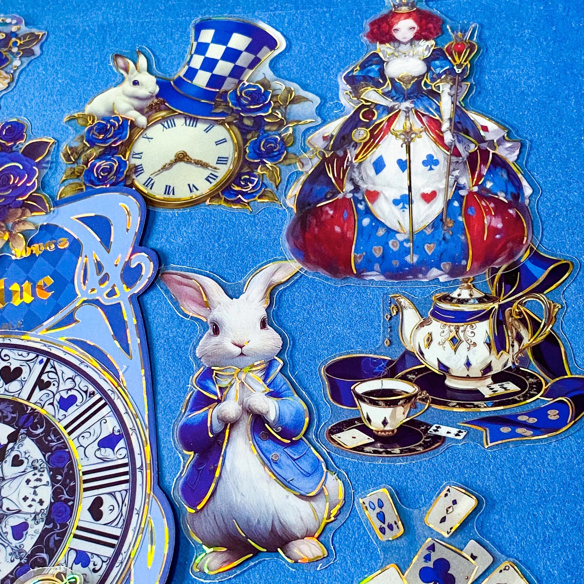 large blue alice in wonderland laser holo holographic plastic stickers featuring white rabbit, alice, clocks, teacups and fantasy illustrations