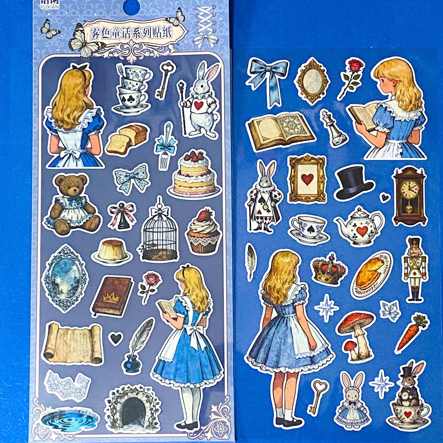 alice's adventures in wonderland matte sticker pack with two distinctive large clear decorative sheets featuring Alice, White rabbit, teacups, cakes, books, mushrooms and wonderland inspired illustrations. uk stationery shop.